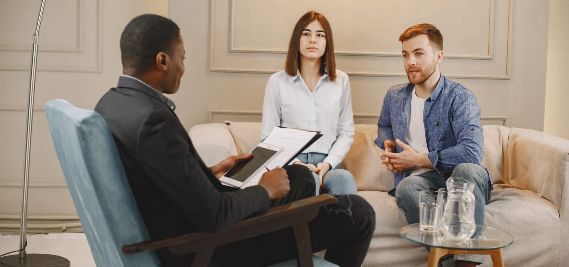 Married couple having problems in their relationship. They are attending pshycologist for advice.